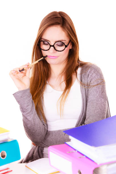 istock Woman sitting at desk in office and thinking 840073518