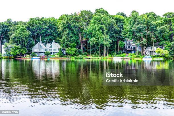 Lake Audubon With Lakefront Waterfront Houses In Reston Virginia With Reflection Of Summer Green Foliage On Trees Stock Photo - Download Image Now
