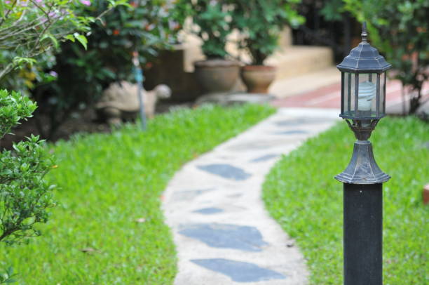 istock walk way and head lamp with green grass landscape 840078558