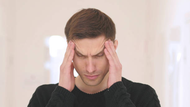 istock Headache, Portrait of Frustrated Working  in Office 840085314