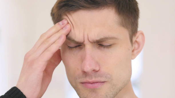 istock Headache, Frustrated Man Face Close Up 840085422