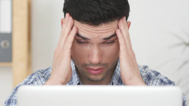 istock Headache, Man Working on Laptop with Head Pain, Close Up 840085434