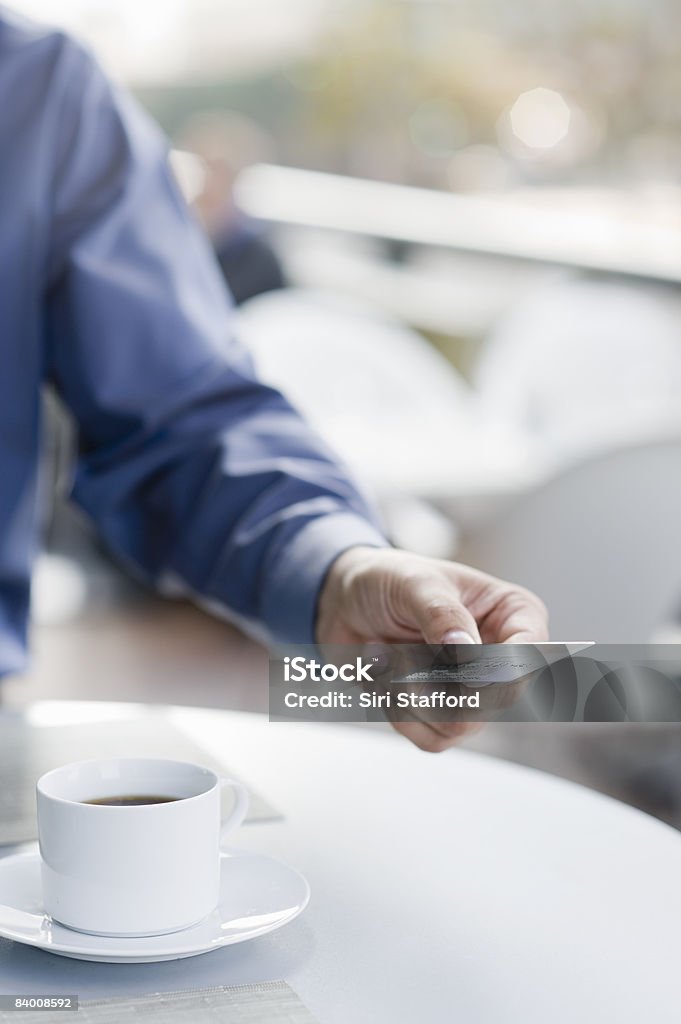 Mans hand presenting credit card.  35-39 Years Stock Photo