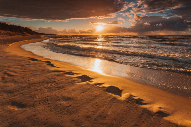 istock Beatiful sunset with clouds over sea and beach 840091894