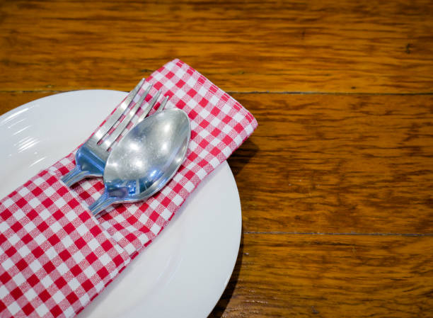 istock set of spoon and fork on white plate 840092128