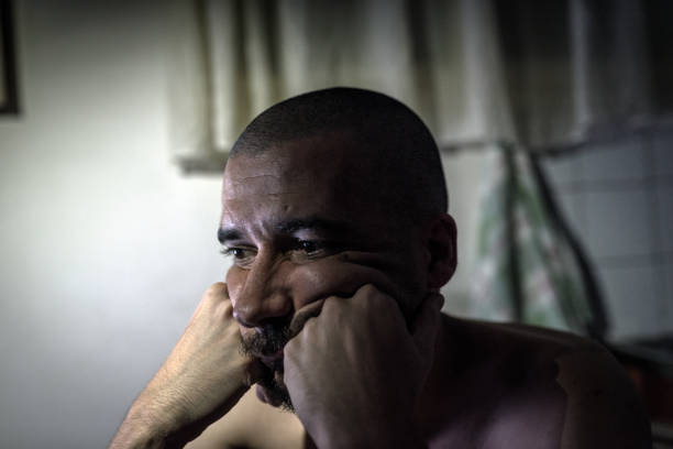 istock The sick man is depressed. Make him like in the world alone. No solution and solution to the problem. 840095984