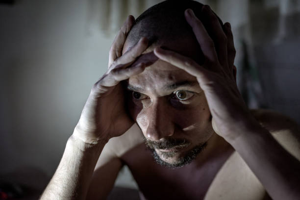 istock The sick man is depressed. Make him like in the world alone. No solution and solution to the problem. 840095990
