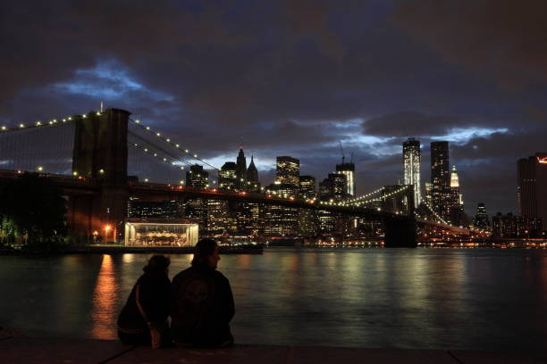 Brooklyn Bridge and New York skyline in cloudy evening stock photo
