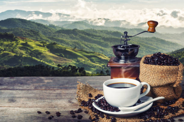 istock Cup of coffee and coffee beans on table 840106596
