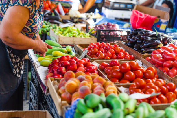 Fruits and vegetables at a farmers market Fruits and vegetables at a farmers market bazaar market photos stock pictures, royalty-free photos & images