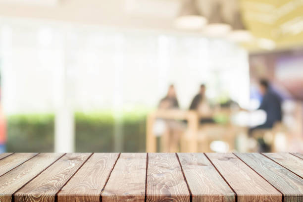 istock Wood table top and blurred restaurant interior background - can used for display or montage your products. 840113408