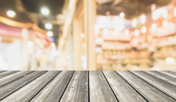 istock Wood table top on blurred with bokeh shopping mall background - can be used for display or montage your products. 840113492