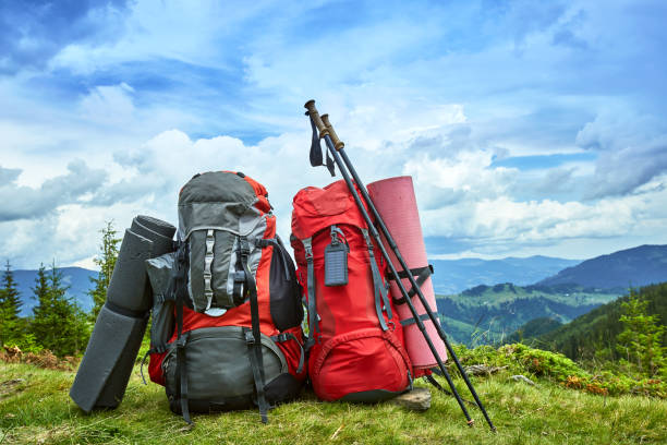 istock Backpacks in the mountains overlooking the mountains on the green grass. 840113530