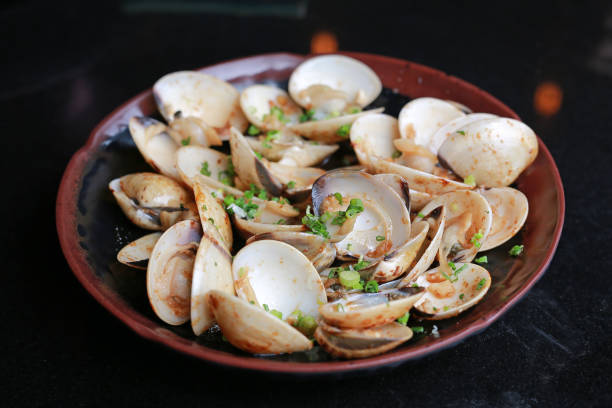 istock Fried Clams with spicy in ceramic plate on black table at restaurant. 840114236
