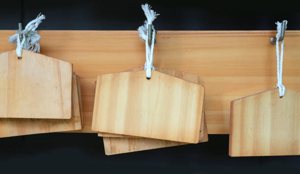 istock Blank wood sign board hanging on wood background. 840124402