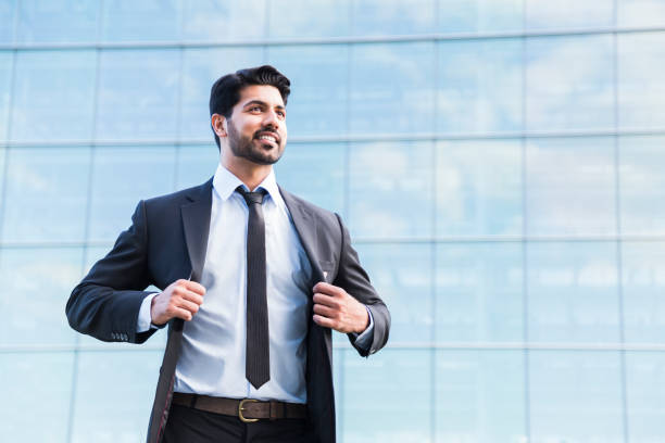 istock Successful businessman or worker standing in suit and holds jacket 840125170