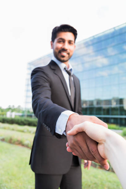 istock Successful arabic businessman or worker shaking hands with person 840125202