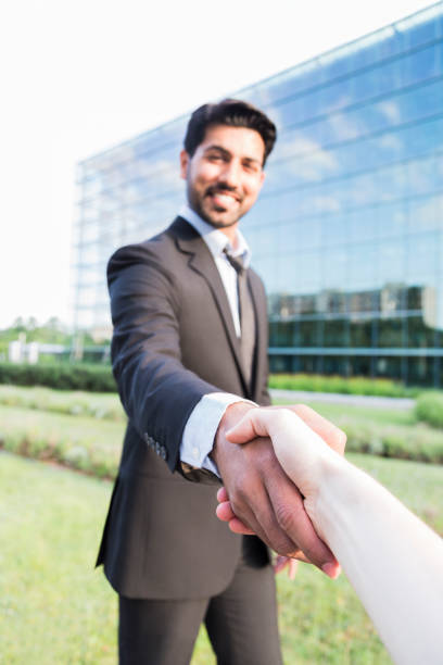 istock Successful arabic businessman or worker shaking hands with person 840125214