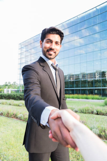 istock Successful arabic businessman or worker shaking hands with person 840125216