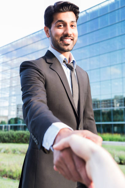 istock Successful arabic businessman or worker shaking hands with person 840125218