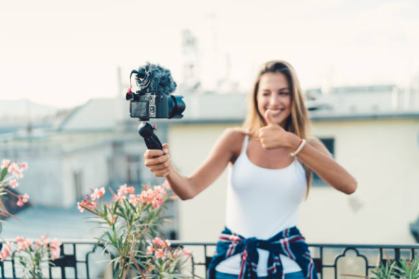 istock Young woman on a vacation vlogging 840128328