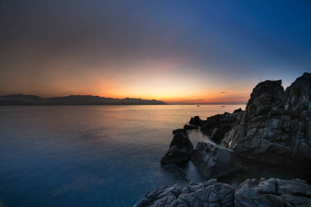 Dawn on the rocks at the sea