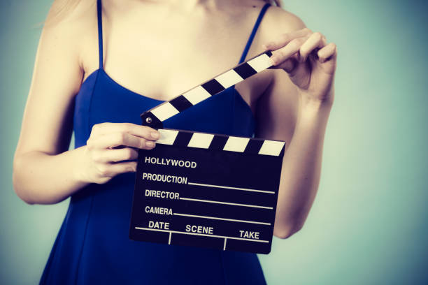 istock Woman holding professional film slate 840133062