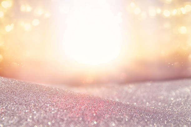 abstract photo of light burst among trees and glitter bokeh lights. image is blurred and filtered .