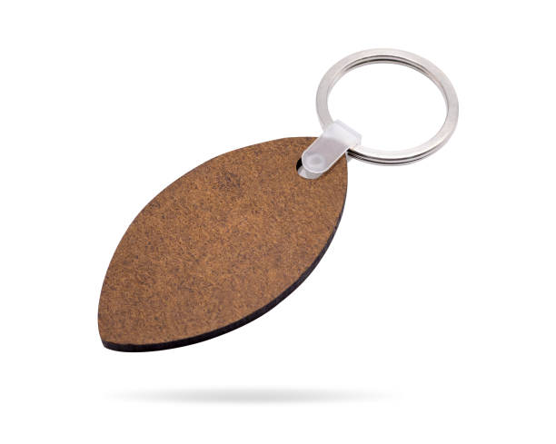istock Wooden key ring isolated on white background. Key chain for your design. Clipping paths object. ( Leaf shape ) 840142760