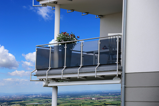 Flower pots with beautiful flowers on a balcony