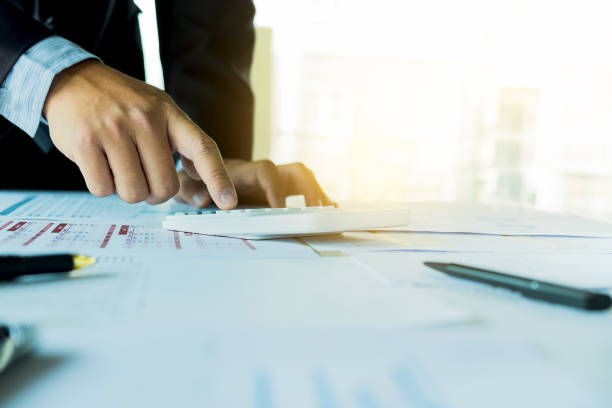 istock Businessman analysis on calculator, new plan financial graph data at the office, business concept 840144352