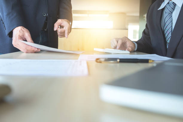 istock Businessman analysis on calculator, new plan financial graph data with business colleagues pointing at paperwork in the office 840144452