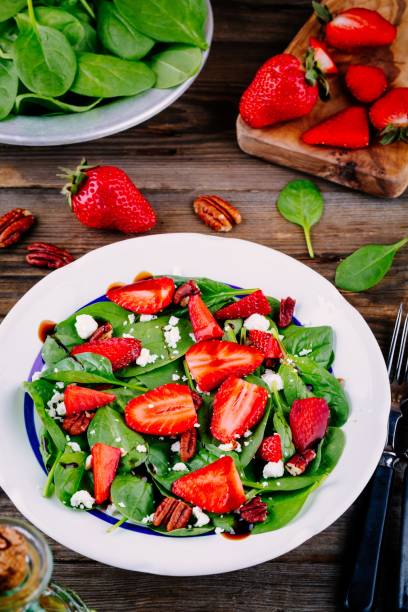 istock Spinach salad with strawberries, goat cheese, balsamic and walnuts 840146914