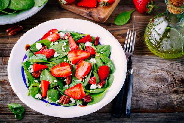 istock Spinach salad with strawberries, goat cheese, balsamic and walnuts 840147008