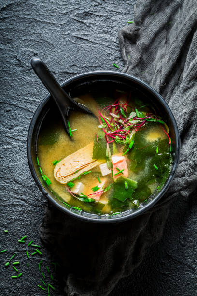 istock Yummy miso soup with salmon on black rock 840154788