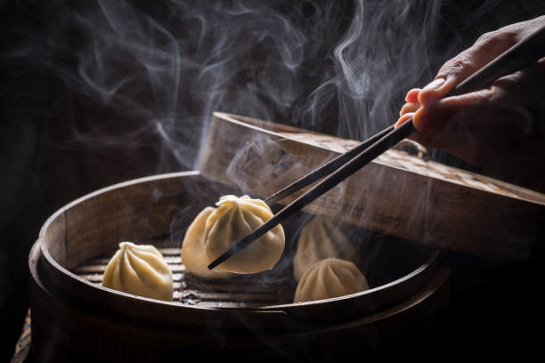 istock Boiled and hot chinese dumplings on black background 840155360