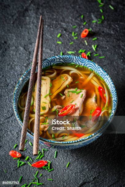 Hot Thai Broth With Beef And Noodle On Black Rock Stock Photo - Download Image Now - Asian Food, Beef, Bowl