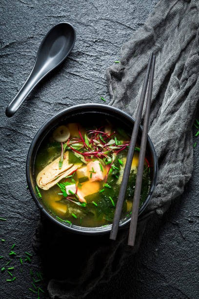 istock Tasty miso soup with salmon on black rock 840158308