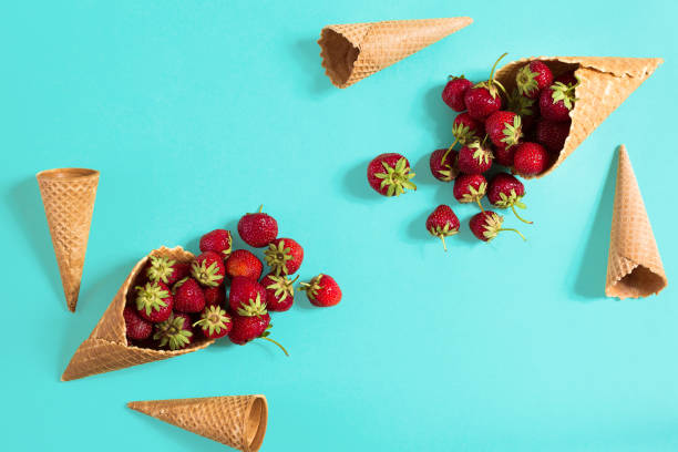 istock Strawberry in a waffle horn on a blue background 840158542