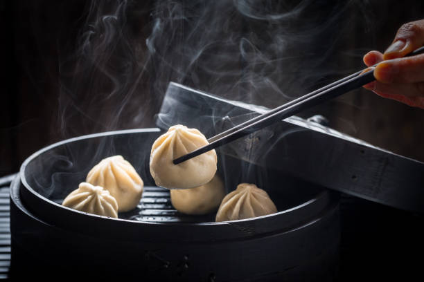 istock Yummy and hot chinese dumplings on black background 840158572