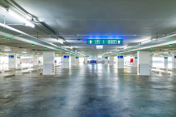 istock Parking garage, underground interior with empty parked cars 840158808