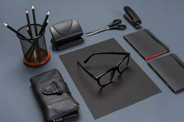 istock A set of black office accessories, glasses on gray background 840159550