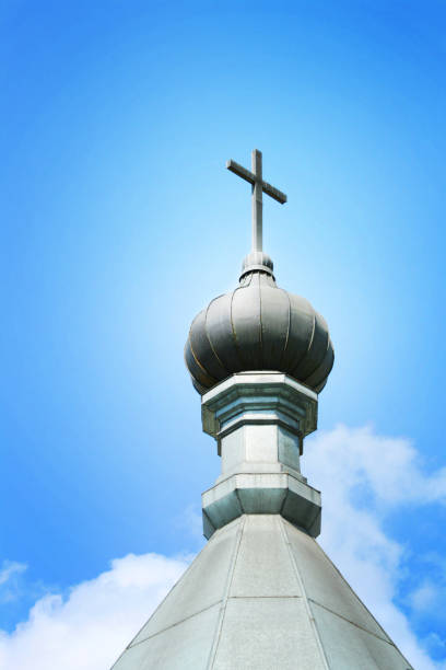 istock dome with a cross at cloudy skies background 840162280