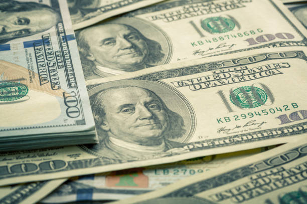 istock Lot of one hundred dollar bills close-up background 840166308
