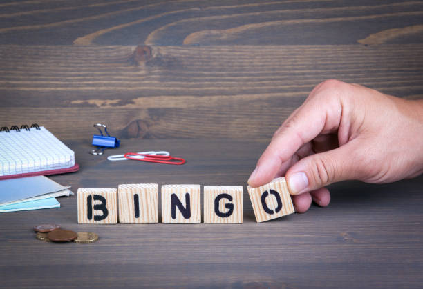 istock Bingo. Wooden letters on dark background 840170154