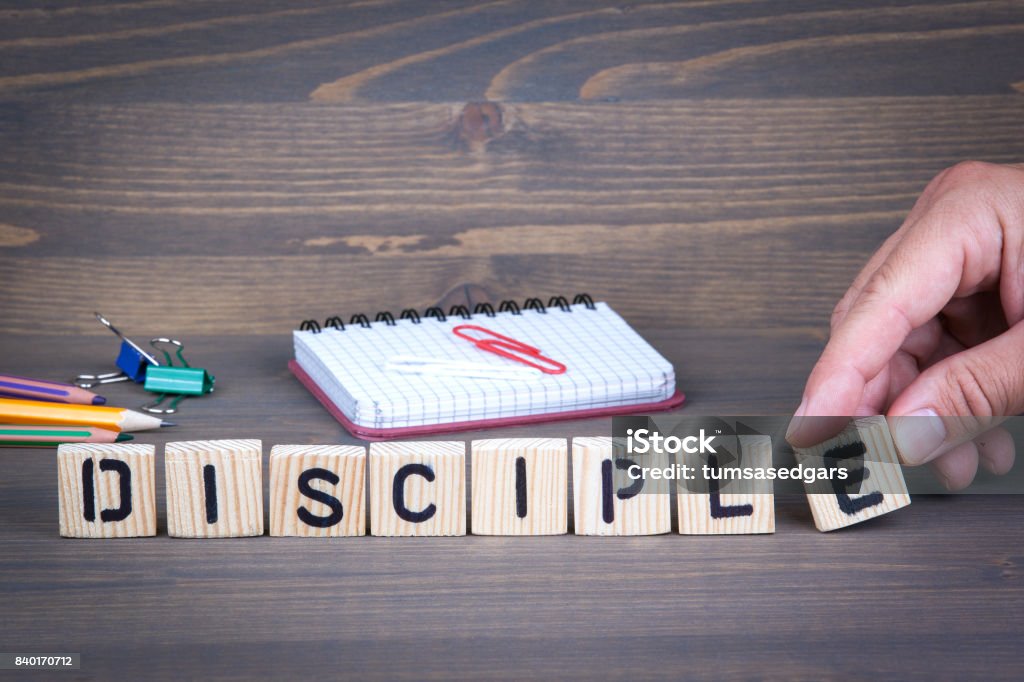 Disciple from wooden letters on wooden background Apostle - Worshipper Stock Photo