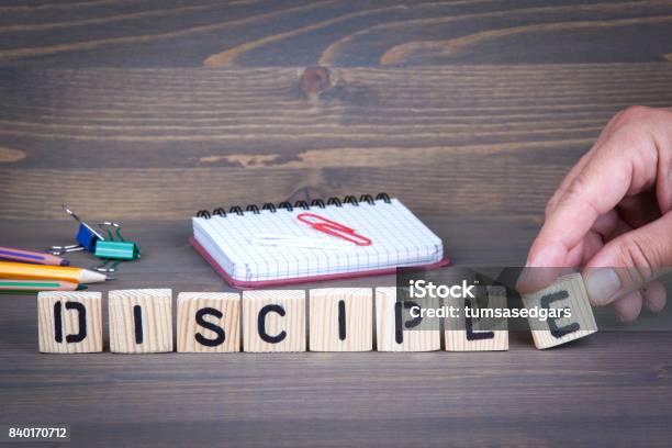 Disciple From Wooden Letters On Wooden Background Stock Photo - Download Image Now - Apostle - Worshipper, Advertisement, Alphabet