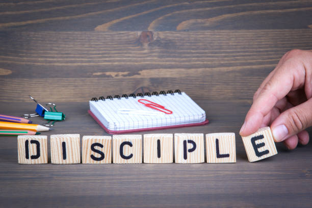 disciple from wooden letters on wooden background - apostle imagens e fotografias de stock