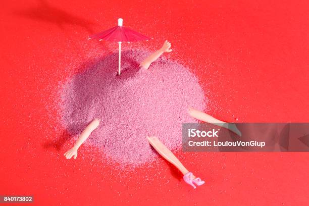 Doll And Pink Sand Stock Photo - Download Image Now - Eccentric, Arm, Arts Culture and Entertainment