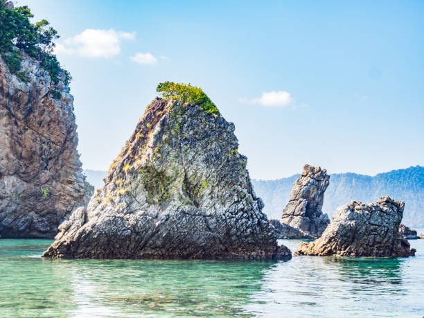 istock Clear blue sea, rock and blue sky for summer vacation. 840173836